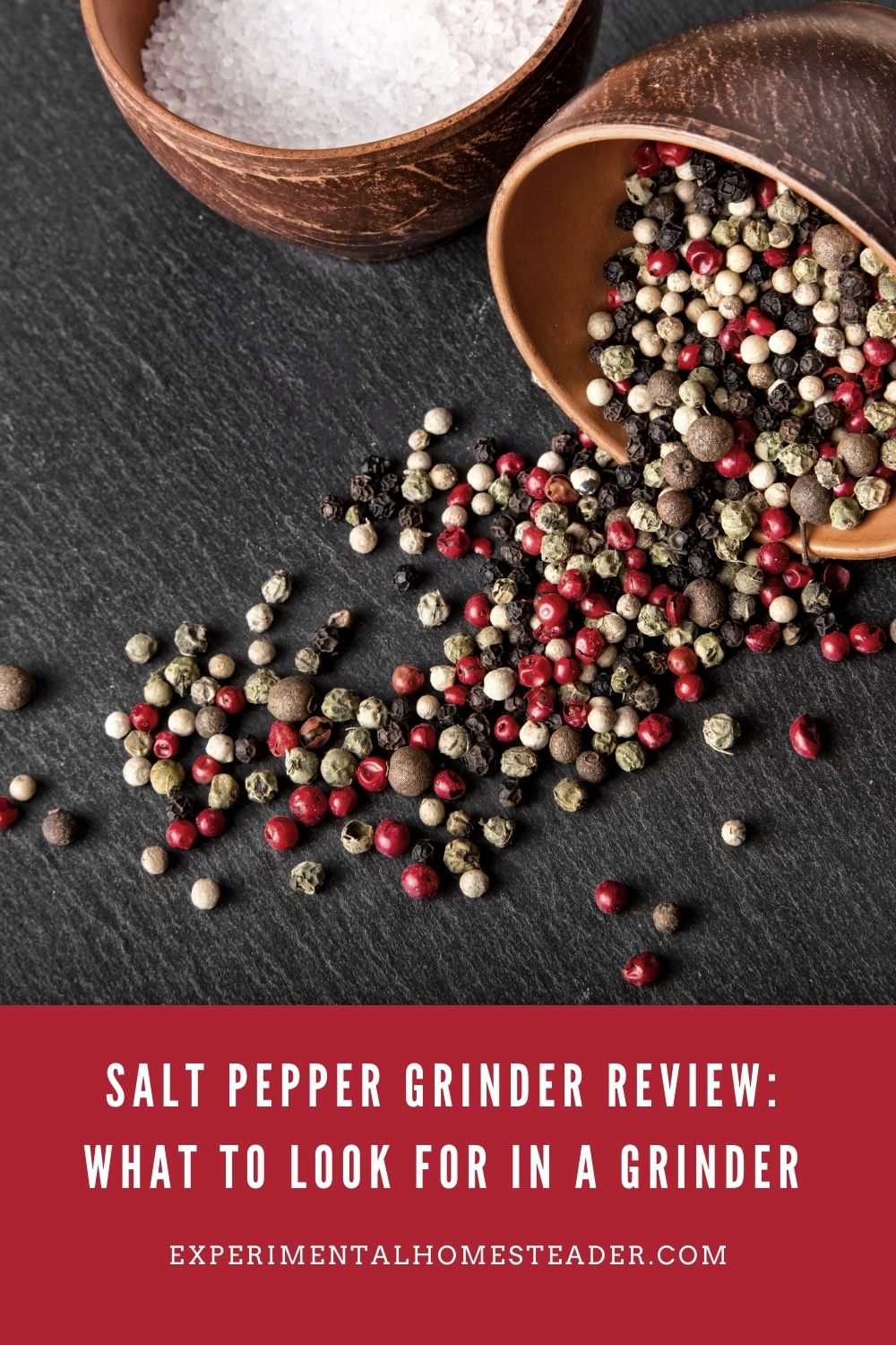 A wooden bowls filled with mixed peppercorns on a slate surface, emphasizing fresh seasoning options.