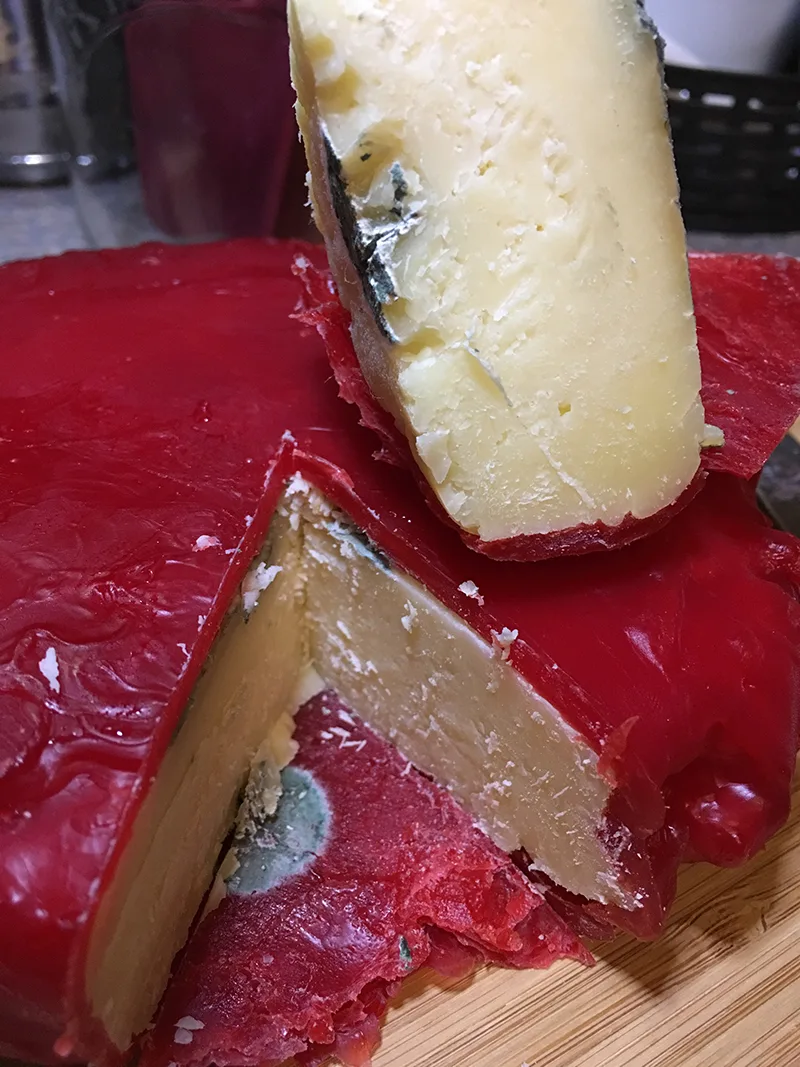 The Parmesan Cheese with mold under the wax.