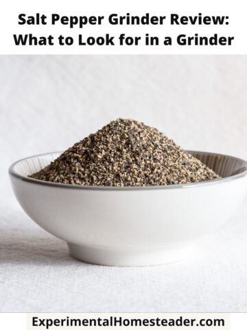 Ground black pepper in a white bowl sitting on a light-colored surface, showcasing freshly ground seasoning for cooking.