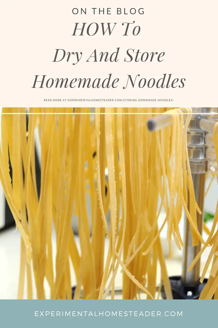 Homemade noodles hanging on a noodle drying rack.