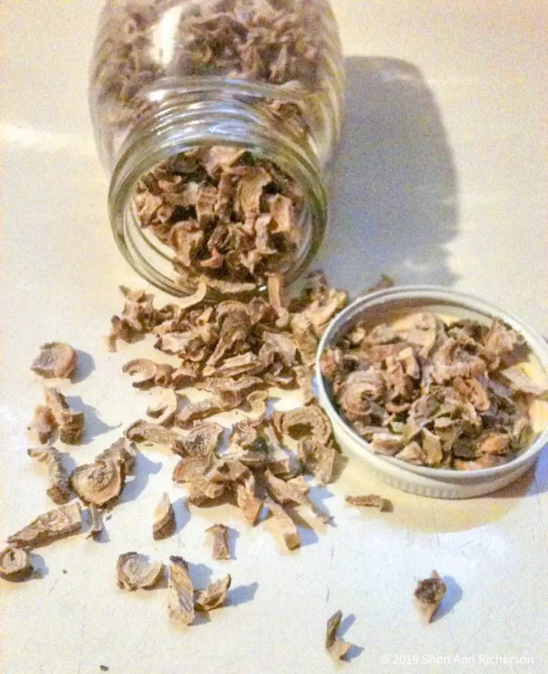 The dried orris root powder in a jar.