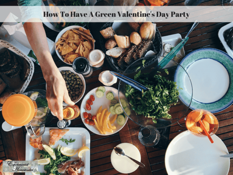 Fresh green salad and snacks at a Valentine's Day party table.