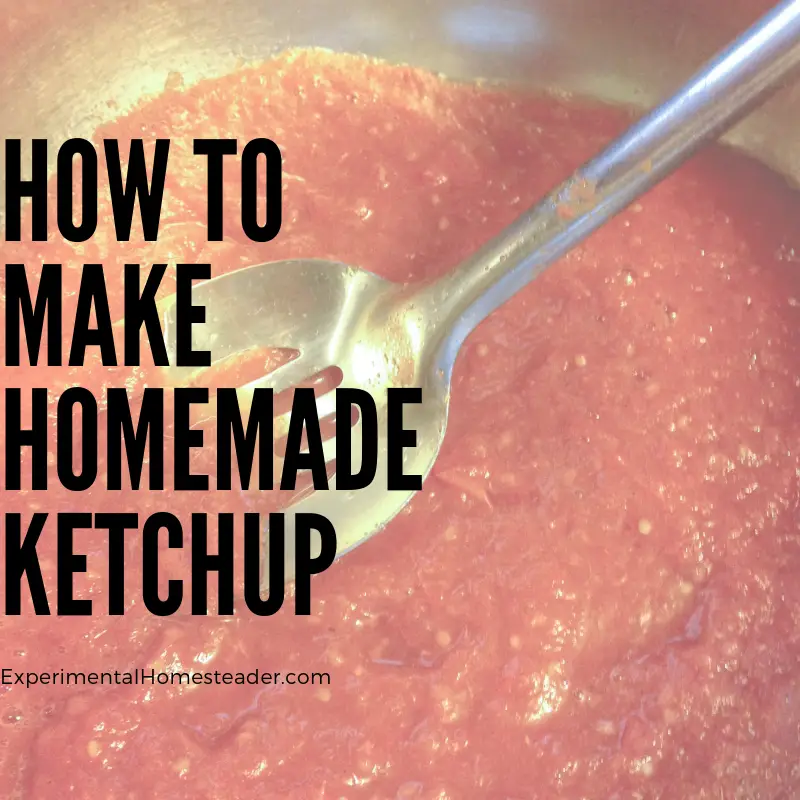 Homemade ketchup in a stainless steel pan being stirred.