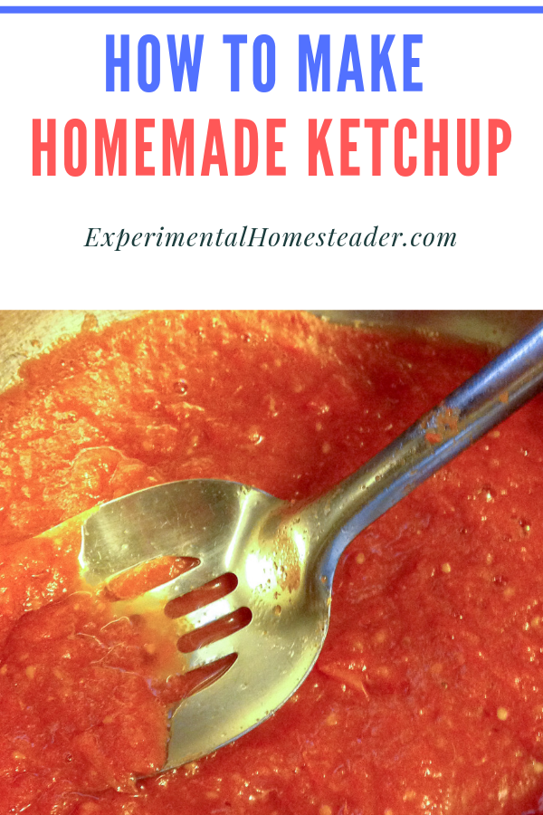 Homemade ketchup in a stainless steel pan being stirred.