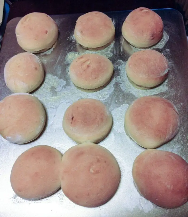 Homemade Swerve Dinner Rolls on a cookie sheet done baking.