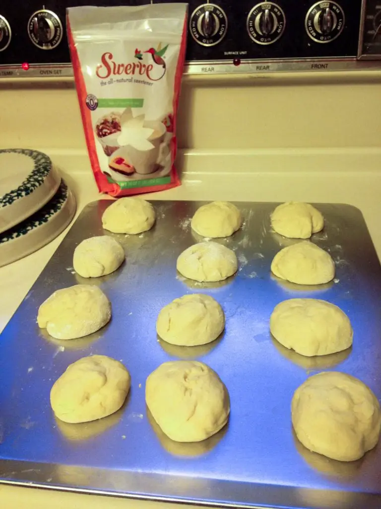 Homemade Swerve Dinner Rolls on a cookie sheet ready to bake.