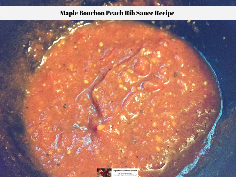 The maple bourbon peach rib sauce recipe in a cast iron melting pot.