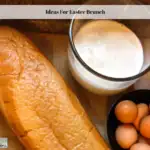French bread, milk and eggs on a cutting board.