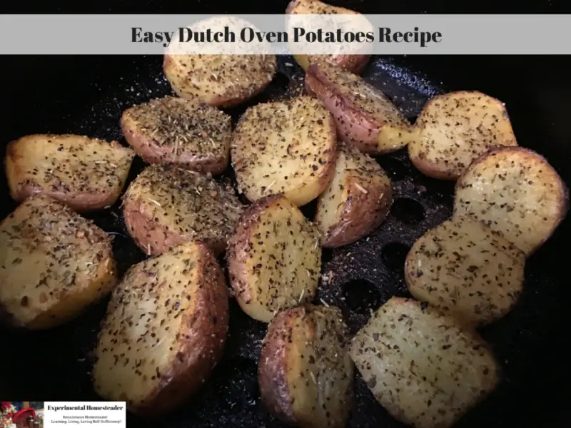 Seasoned potatoes cooking in a cast iron Dutch oven.