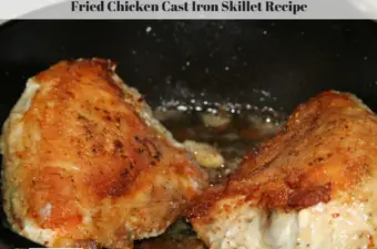 This photo is of browned fried chicken breasts in a cast iron skillet.