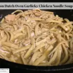 Chicken noodle soup in a cast iron dutch oven.