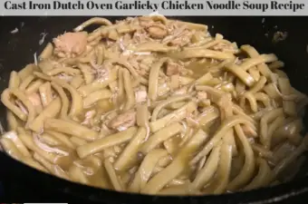 Chicken noodle soup in a cast iron dutch oven.