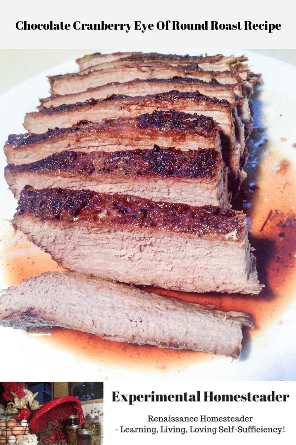 The chocolate cranberry eye of round roast sliced and resting on a plate.