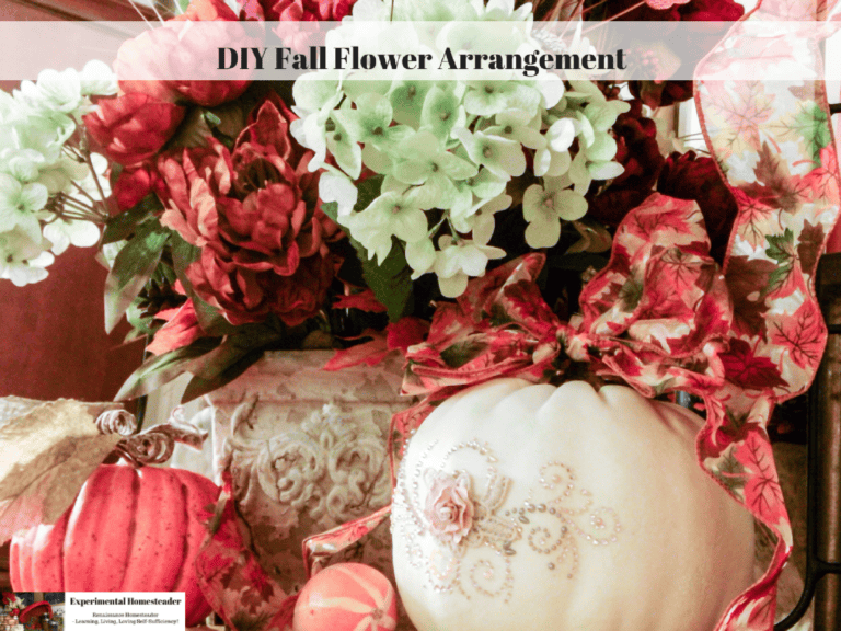 Vase with fall flower arrangement including hydrangeas, poinsettias, and festive ribbons for autumn decor.