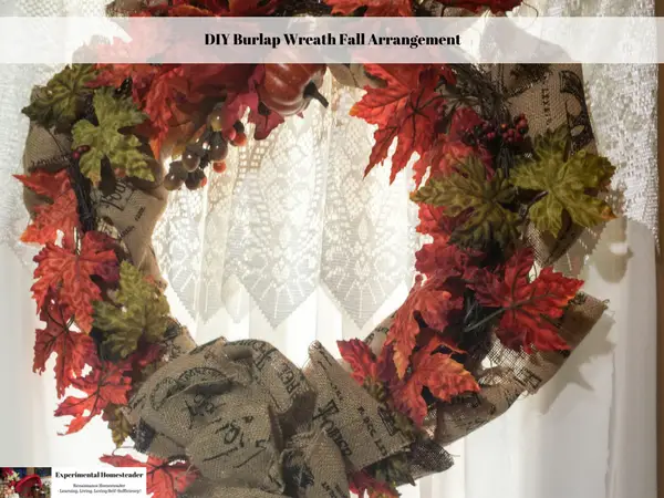 A DIY Burlap Wreath Fall Arrangement hanging on the front door.