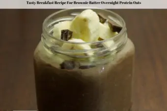 The photo shows the ready to eat Brownie Batter Overnight Protein Oats topped with bananas and dark chocolate chunks.
