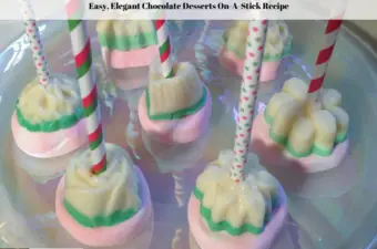 Molded elegant chocolate desserts on a plate.