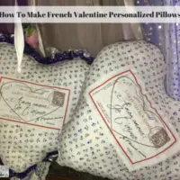 Two heart shaped pillows laying side by side on a bed.