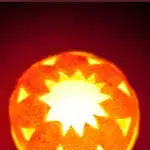 An orange with a candle in it to create an orange luminary table decoration.