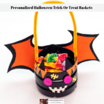 A homemade personalized Halloween trick or treat basket in the shape of a bat.