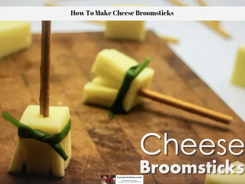 The photo shows a cheese broomsticks on a cutting board.