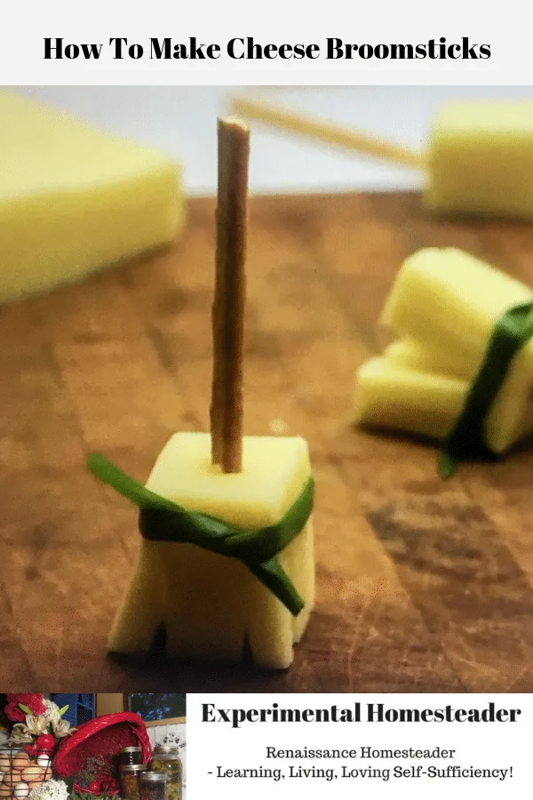 The photo shows a cheese broomsticks on a cutting board.