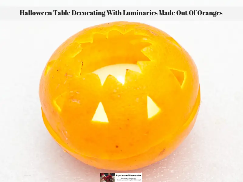 An orange peel turned into a luminary with a candle inside of it.