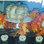Three cute owl fall buffet table decorations.