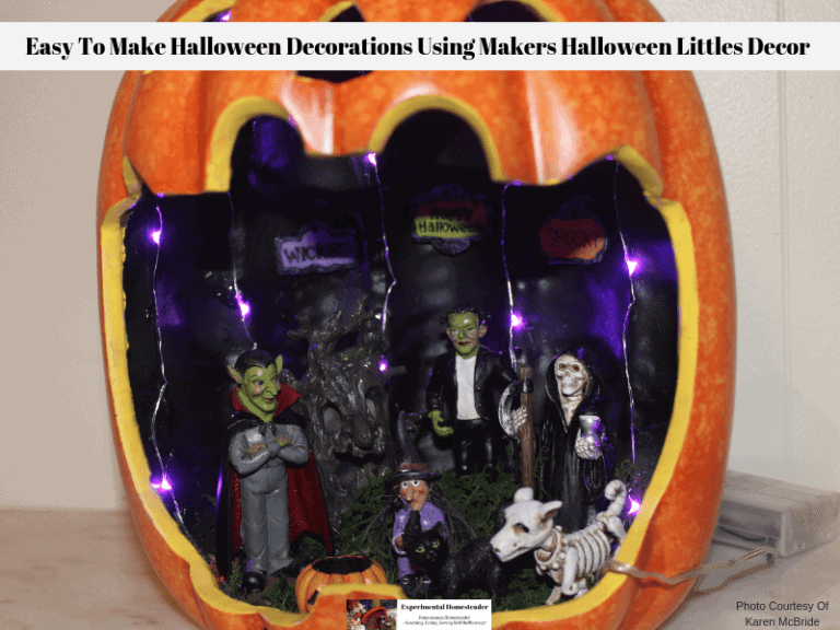 A ready to display Maker's Halloween Littles Jack O'Lantern Container Fairy Garden lit up with purple LED lights.