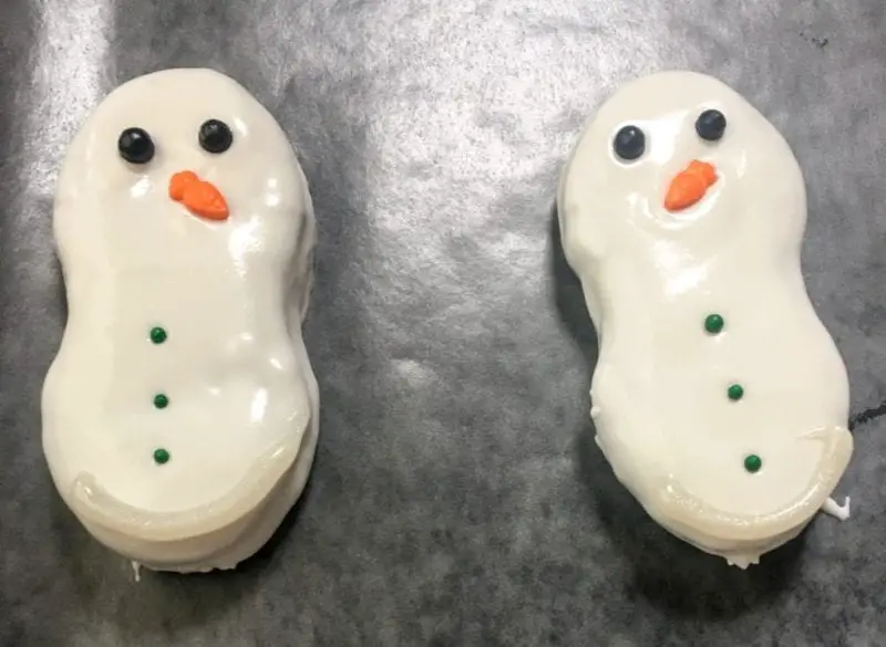 Two decorated Nutter Butter Cookies.