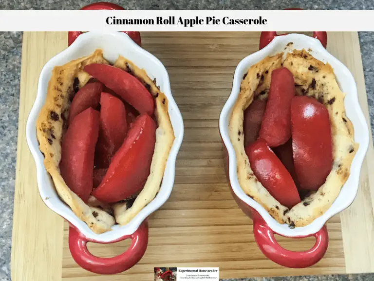 Baked Cinnamon Roll Apple Pie Casserole sitting on a wooden butcher block on a counter top.
