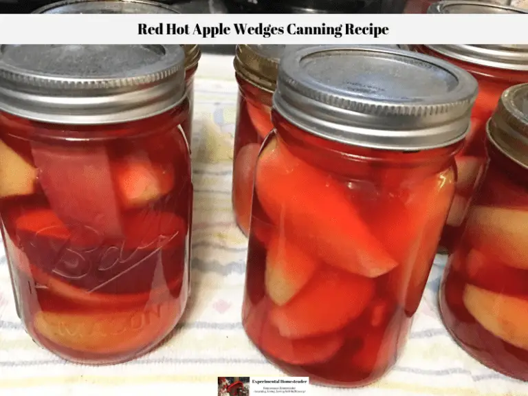 A completed red hot apple recipes canning recipe with the apples in the sealed jars.