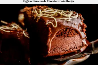 A slice of eggless homemade chocolate cake being removed form the main cake in order to serve it.