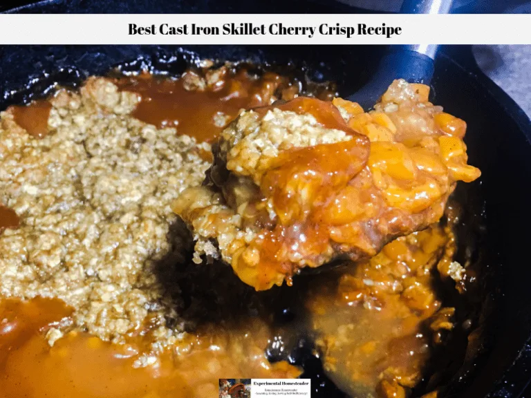 Cherry crisp being dipped out of a cast iron skillet.