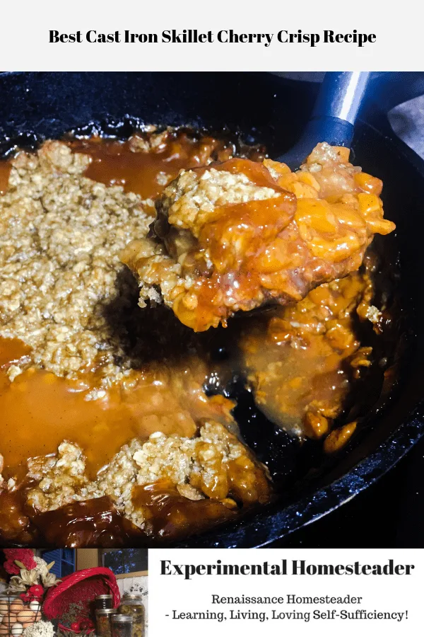 Cherry crisp being dipped out of a cast iron skillet.