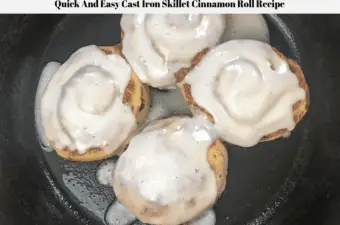 Cinnamon rolls in a cast iron skillet.