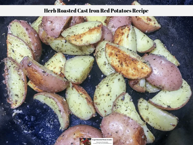 Herb roasted cast iron red potatoes in a cast iron skillet.