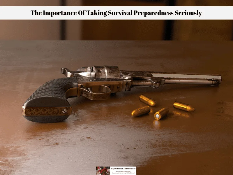 A gun and bullets laying on a table.