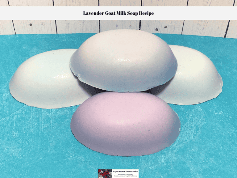 Four bars of this lavender goat milk soap recipe ready to wrap in Saran Wrap and store.