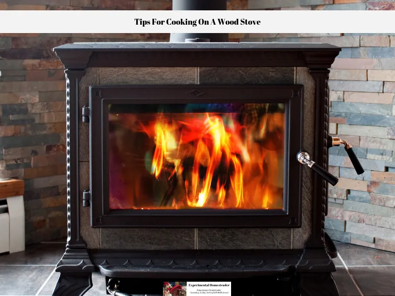 A wood burning stove with a blazing fire.