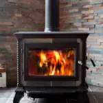 A wood burning stove with a blazing fire.