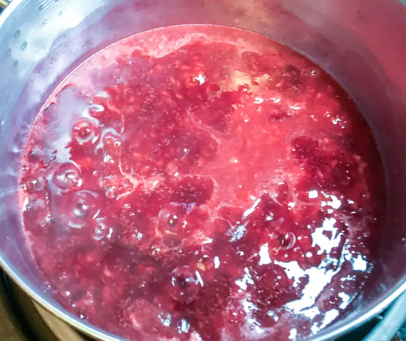 The raspberry sauce coming to a boil.