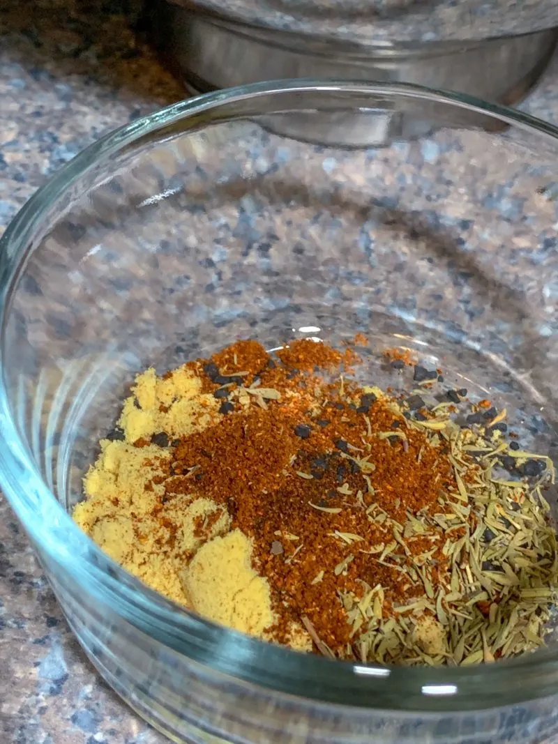 The spices measured out and placed in a container to make it easy to add them to the creamy penne pasta sauce.