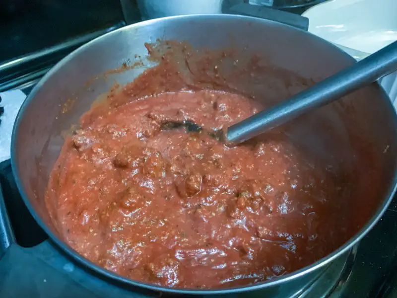 The sauce being simmered on the stove top.