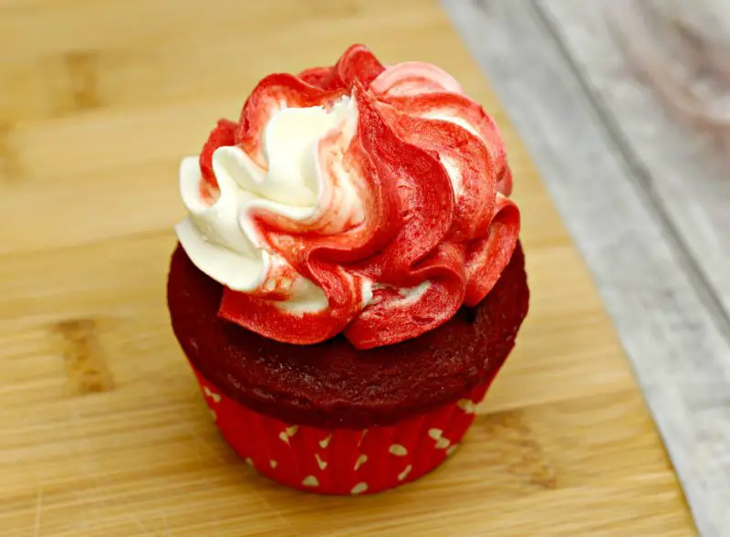 The red velvet cupcakes with frosting on them.