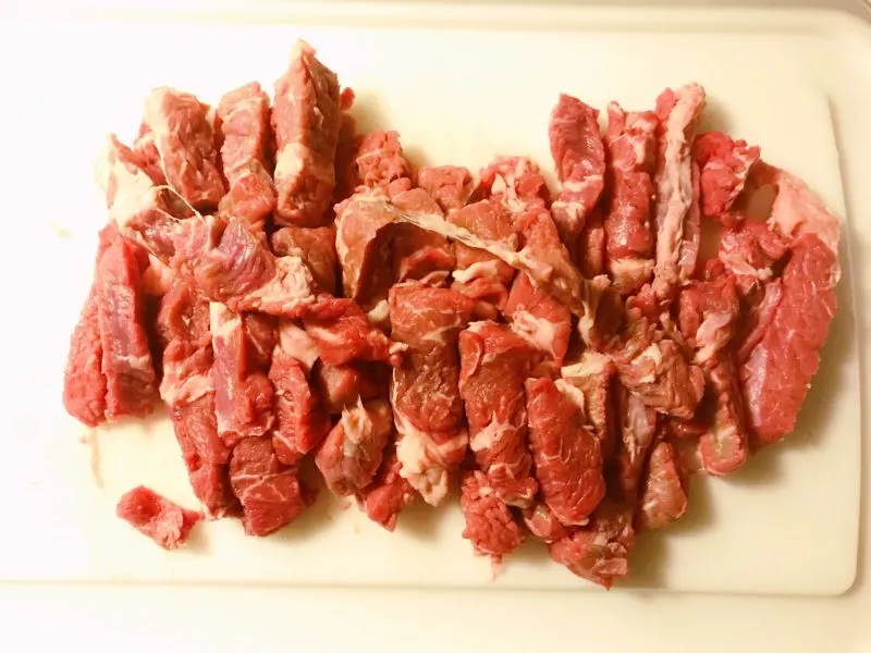 The beef sliced into thin strips.