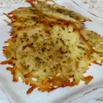 The baked cheese crisps sitting on a plate ready to be served.