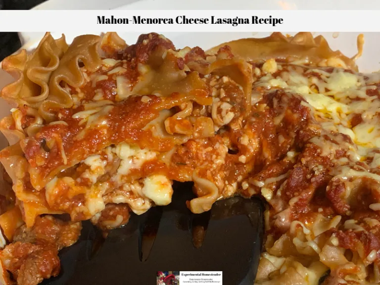 A slice of this cooked cheese lasagna being lifted out of the pan.