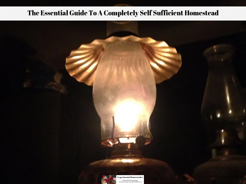 A lighted kerosene lamp sitting on a table.