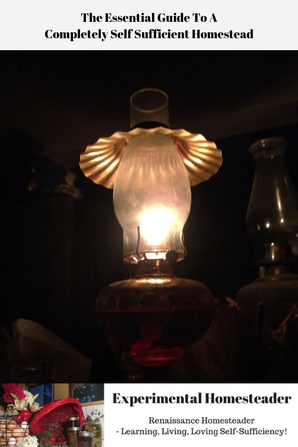 A lighted kerosene lamp sitting on a table.